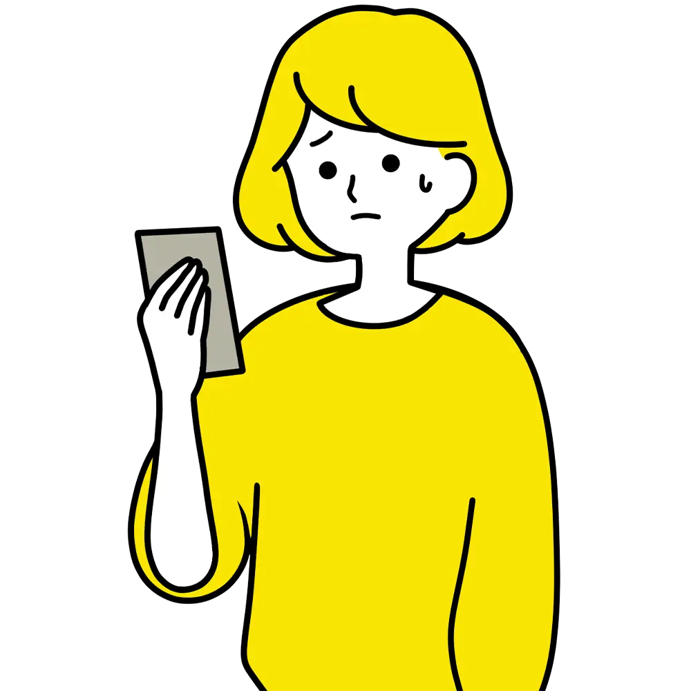 スマホを持って悩む女性